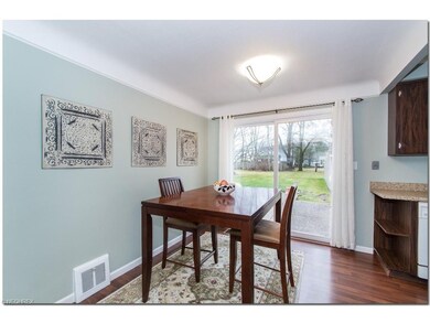 Living Room Opens to Dining Room with Newer Lamina