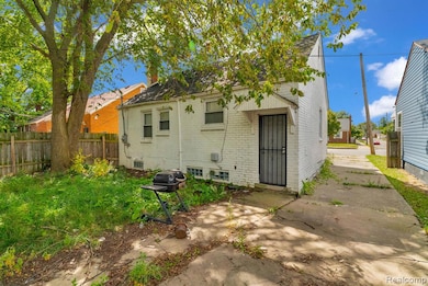Back of property with brick siding