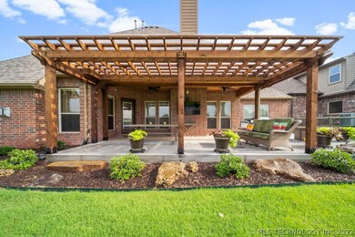 New extended back patio with pergola with an aweso