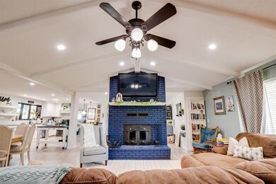 Living Room with Wood Burning Fireplace including