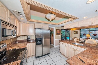 Custom solid wood cabinets, gorgeous granite.