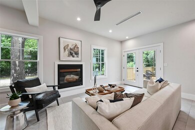 Living room with a wealth of natural light, a gla