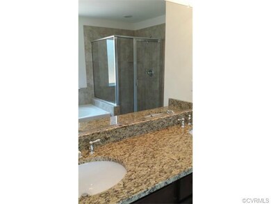 Master bath with double sinks, ceramic shower and 