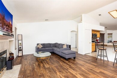 Family room open to kitchen.  Vaulted ceilings.