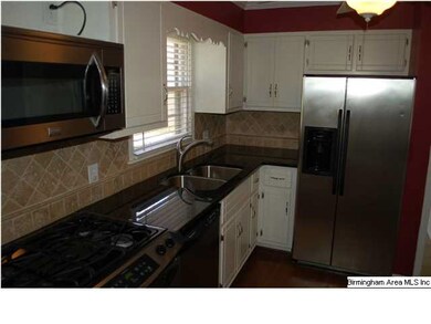 Beautiful kitchen has been updated with granite co