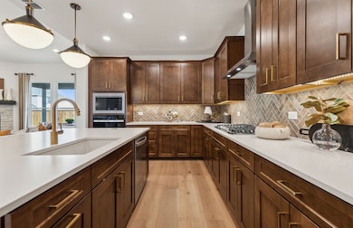 Kitchen featuring a large island ideal for informal dining and gatherings *Model representation
