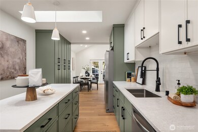 Just beyond the kitchen is even more storge with the bank of pantry cabinets to the left.