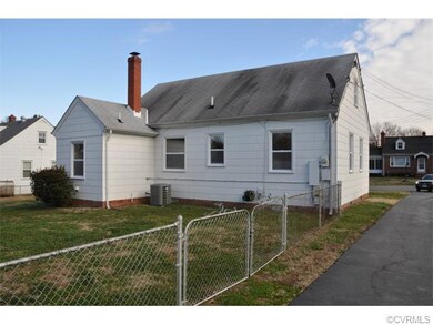 Rear of house. Heat pump, fenced yard, paved drive