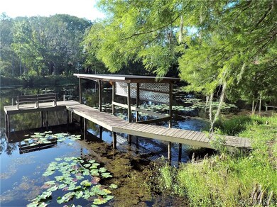 Dock and boat shelter lead out into Lake Hamilton