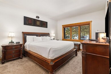 Bedroom with light colored carpet