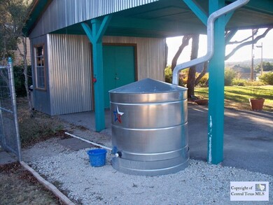 Cisturn: One car carport with storage above and behind, water catchment for watering. Chain link fenced doggy yard or protected (from deer)garden area