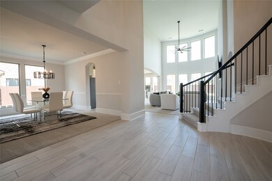 Entryway to the formal dining and amazing spiral staircase.