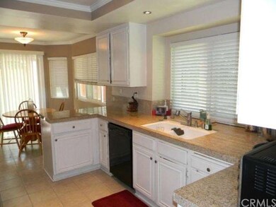 Another angle of the kitchen as it opens to the in