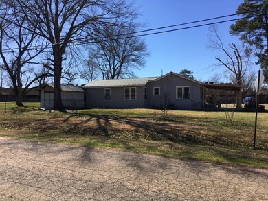 View of front of house with a storage shed, metal 