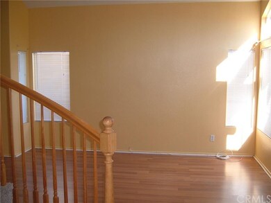 Laminate flooring in living room, warm natural lig