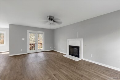 FAMILY ROOM VIEW ~  WOOD BURNING FIREPLACE WITH BR