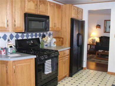Kitchen. ANOTHER VIEW OF THE KITCHEN SHOWING OPENI