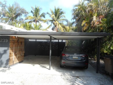 View of car parking featuring a carport