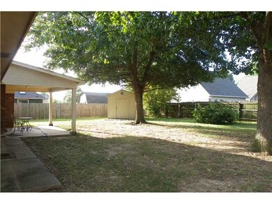 View of rear yard,covered patio and storage shed. 