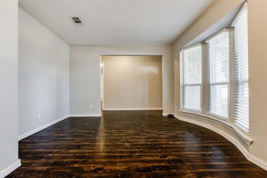 Bowed windows in the formal dining offer plenty of