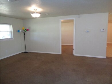 3rd view of living room. Updated light fixtures.