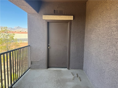 Entrance to property featuring a balcony, stucco s