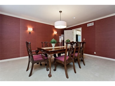 Professionally decorated dining room with grassclo