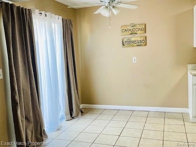 Eating area has a ceiling fan.