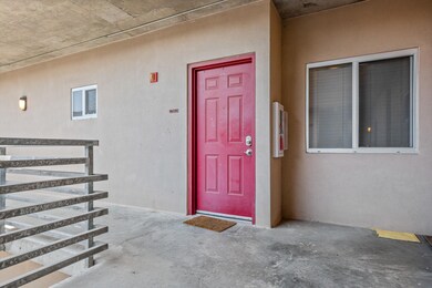 Entrance to property featuring stucco siding
