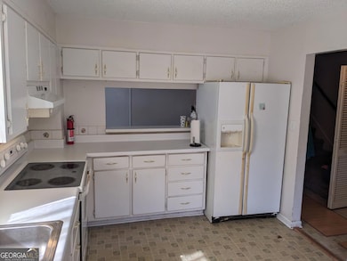 Kitchen view of window to dining area