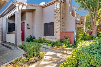 Doorway to property with brick siding and stucco siding