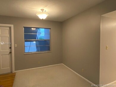 Facing dining area and front door
