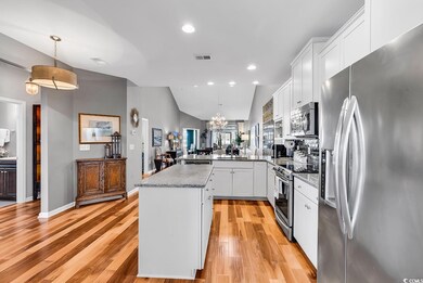 Kitchen with island, open floor plan, appliances w