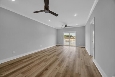 Empty room with recessed lighting, ornamental mold