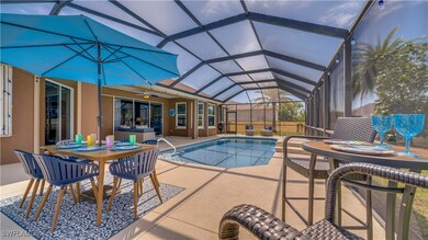 Outdoor pool featuring screen enclosure, a patio a