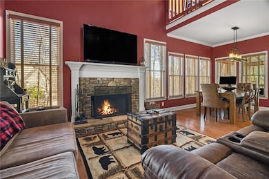 Living room with a notable chandelier, ornamental 