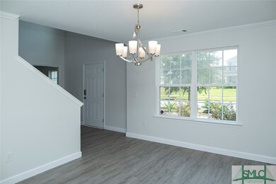 Formal dining room with entry to island kitchen.