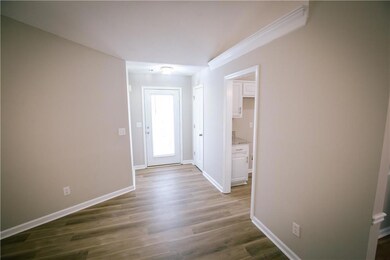 The entry way features new flooring.