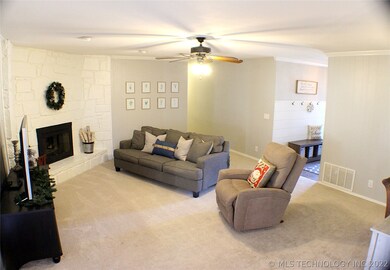 Spacious living room with grand fireplace. New pot