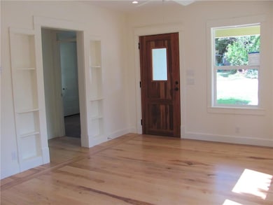 Foyer entrance with light wood-type flooring and 