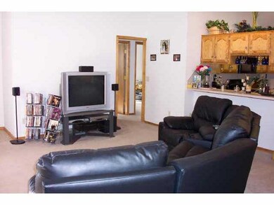 Other. Nice size living room with ceiling fan and 