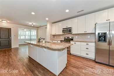 Granite countertops and large island with extra ba