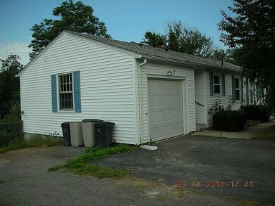 Exterior Front. Left Side w/Garage