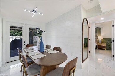 Dining area featuring french doors, lofted ceiling