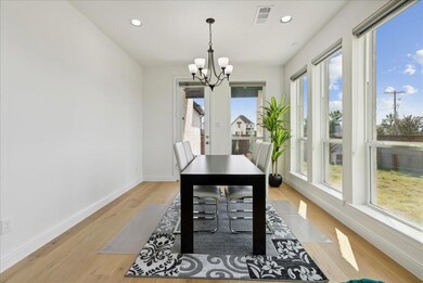 Dining space featuring visible vents, baseboards, an inviting chandelier, light wood-style flooring, and recessed lighting