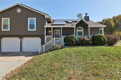 This home features a front porch, newer windows, and fiberglass roof