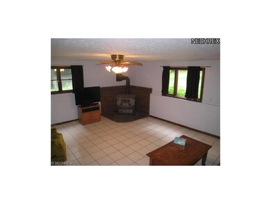 Large family room with wood burner.