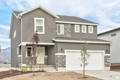 View of front of home featuring stone siding, a garage, concrete driveway, and stucco siding