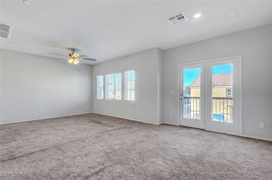 Carpeted spare room with baseboards, ceiling fan,