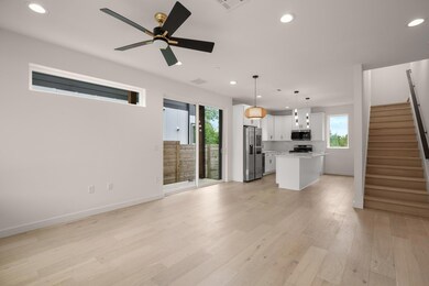 Unfurnished living room featuring stairs, recesse